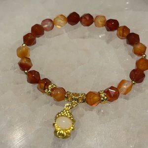 Handcrafted bracelet with faceted agate and buddha charm